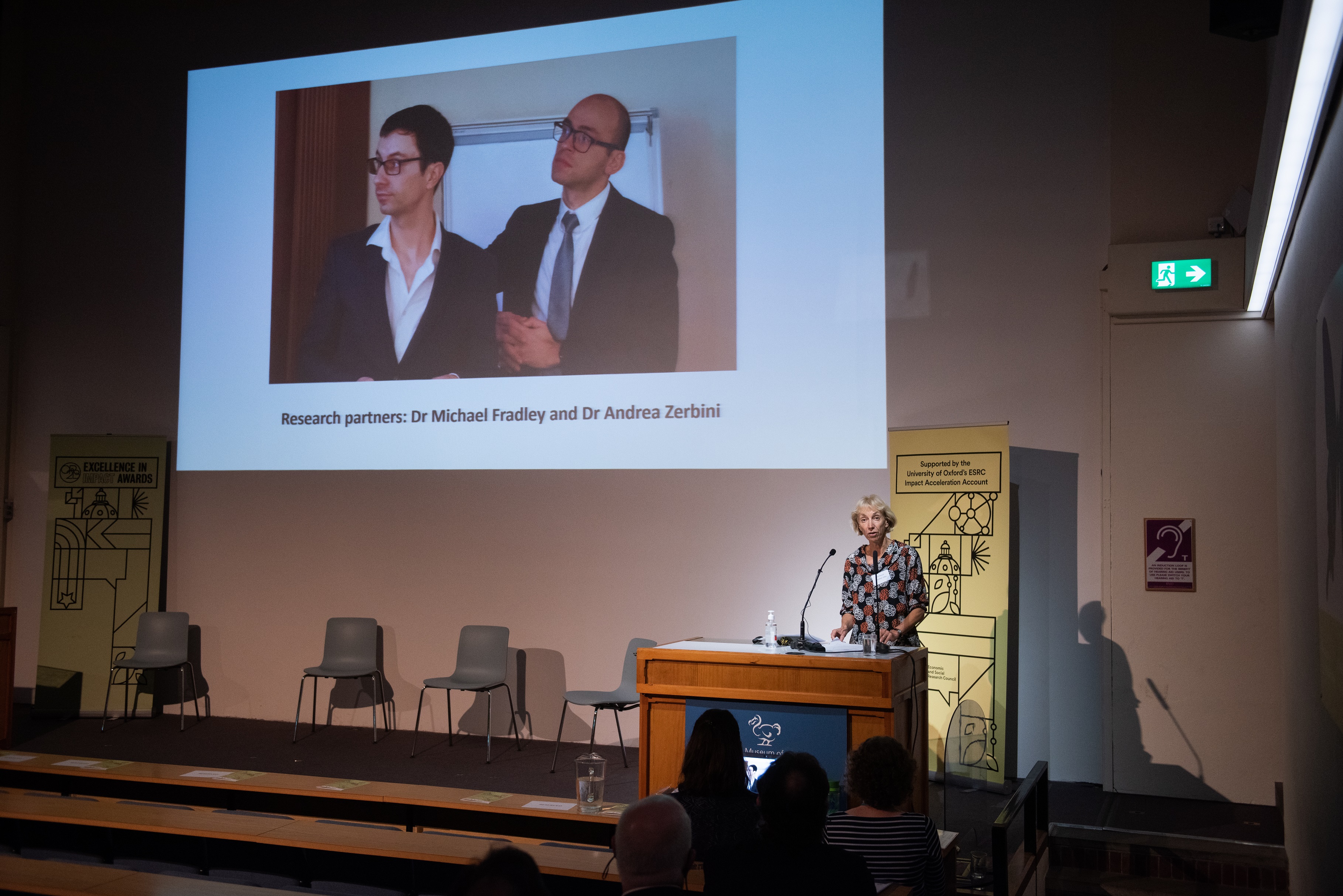 Presentation screen at the awards ceremony shows a photograph and special mention of Dr Michael Fradley and Dr Andrea Zerbini