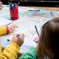 children using a map and drawing