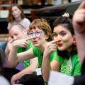 Researchers in the middle of singing and pointing at their noses