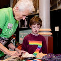 Lady and young child looking at objects