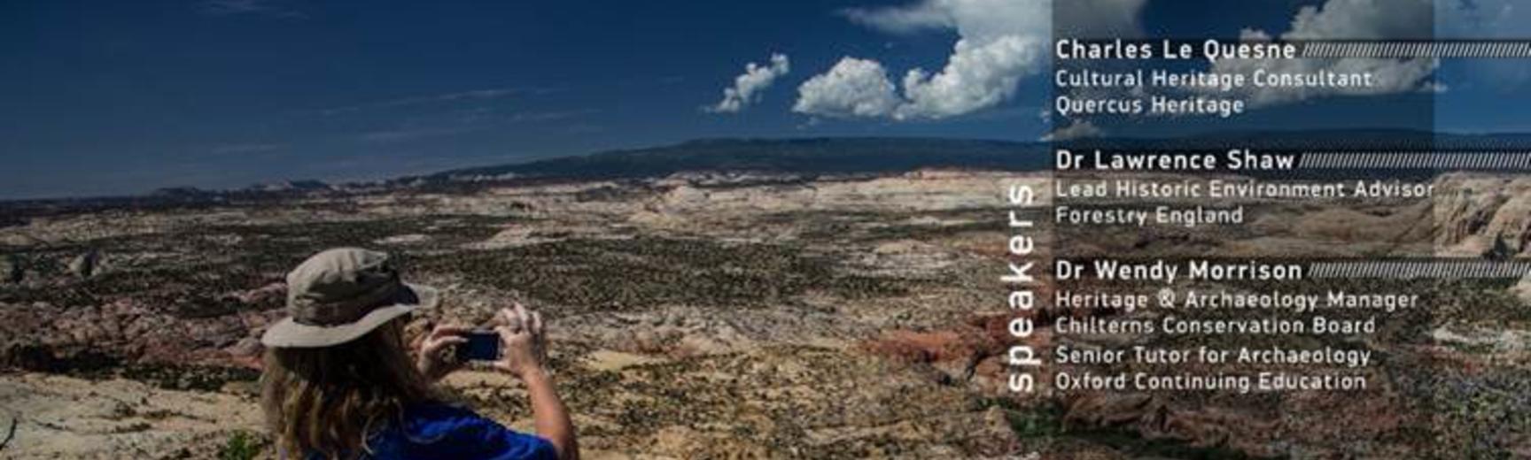 A person in a blue tshirt and wearing a sun hat and short photographs a hot, arid landscape. Text: 01/03/2023: Innovating in Environmental Archaeology