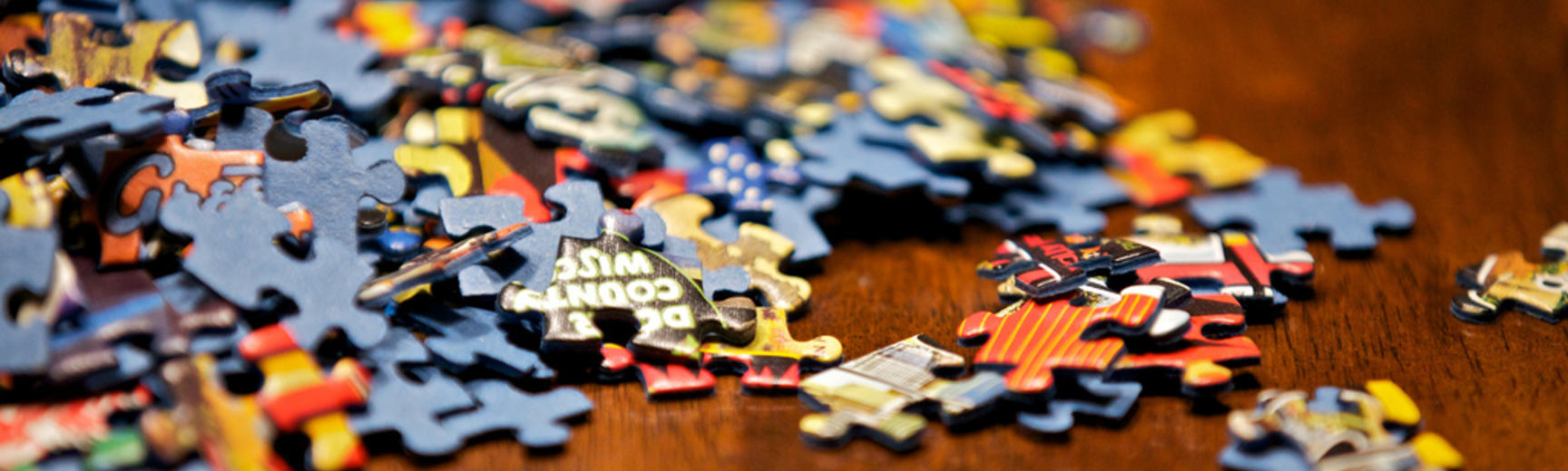 A pile of jumbled up jigsaw pieces