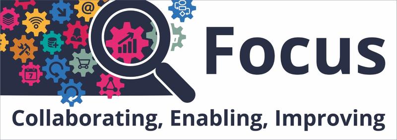 Focus Logo - Navy and white logo with multi coloured cogs - each with a different symbol on it - and a large magnifying glass