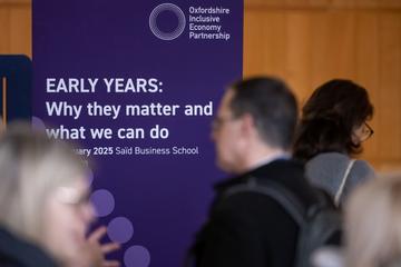 OIEP Early Years Summit An event banner with the words "Early Years: Why they matter and what we can do" amongst a busy room of delegates