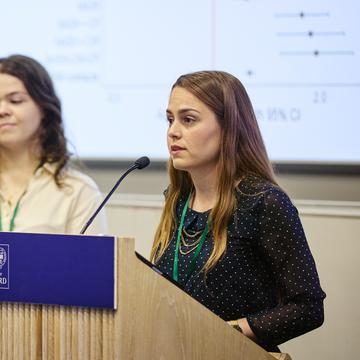 Savannah Verhage addresses an audience from the lectern