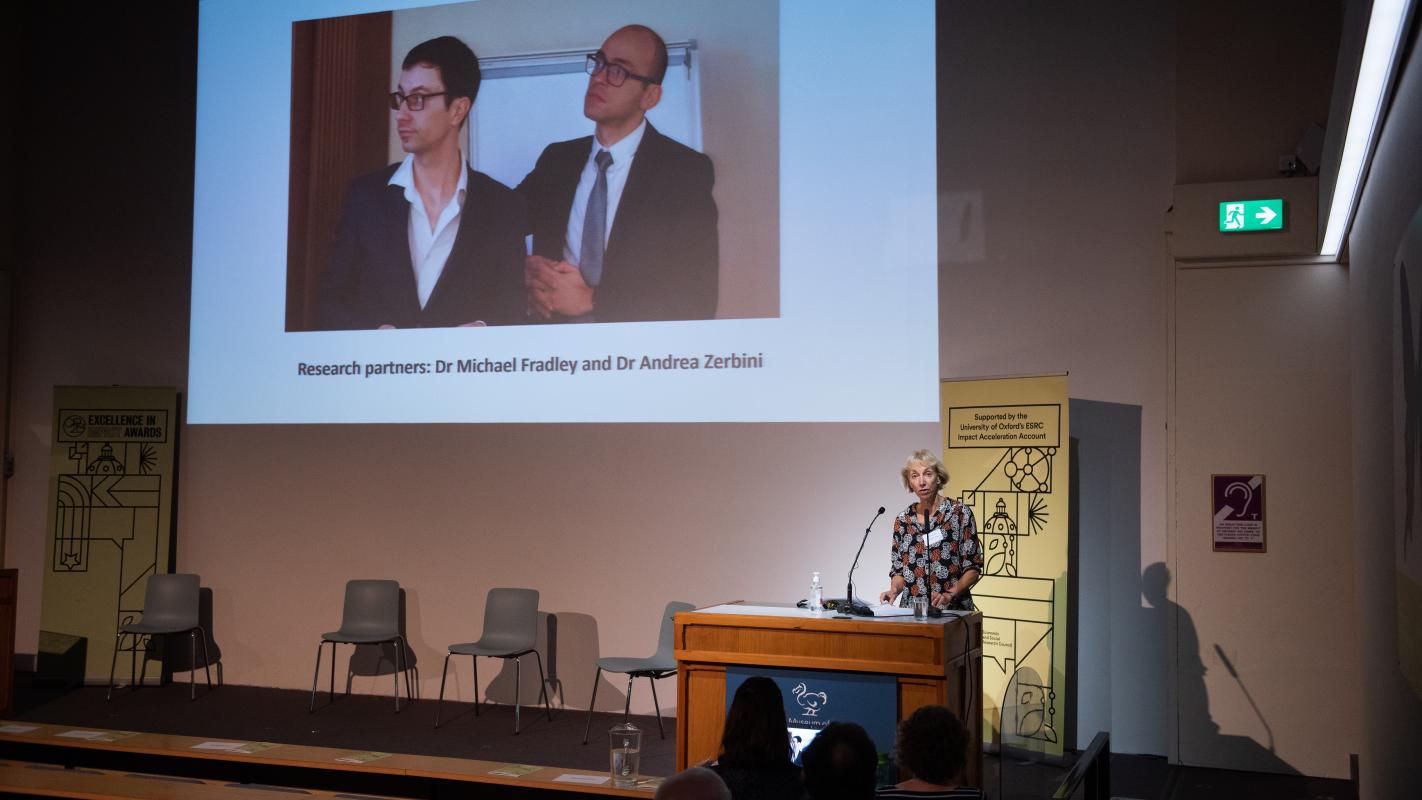 Presentation screen at the awards ceremony shows a photograph and special mention of Dr Michael Fradley and Dr Andrea Zerbini