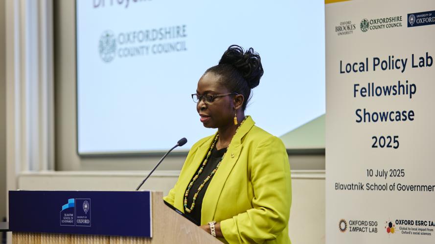 Dr Foyeke Tolani addresses an audience from the lectern