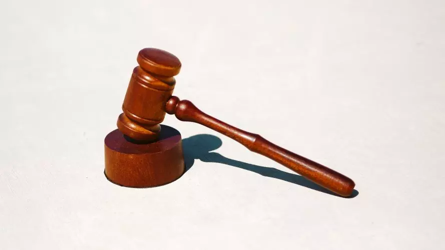 A wooden gavel and block