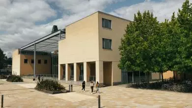 The Said Business School, Park End Street, with students walking past.