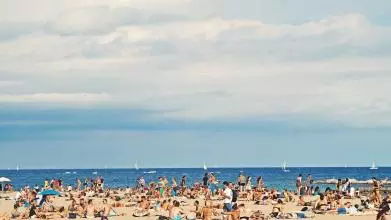 Crowds of people on a sunny beach