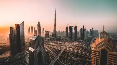 Aerial view of Downtown Dubai and Burj Khalifa, showing a complex intersection of several roads