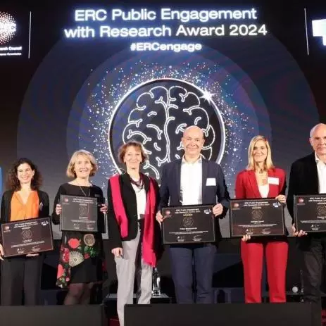 Professor Lucie Cluver on stage alongside fellow winners of the ERC Public Engagement Awards 2024