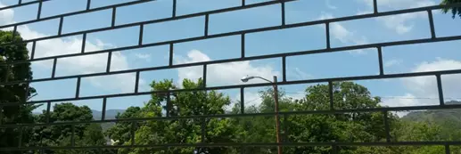 Image of a detention centre with bars across the whole image